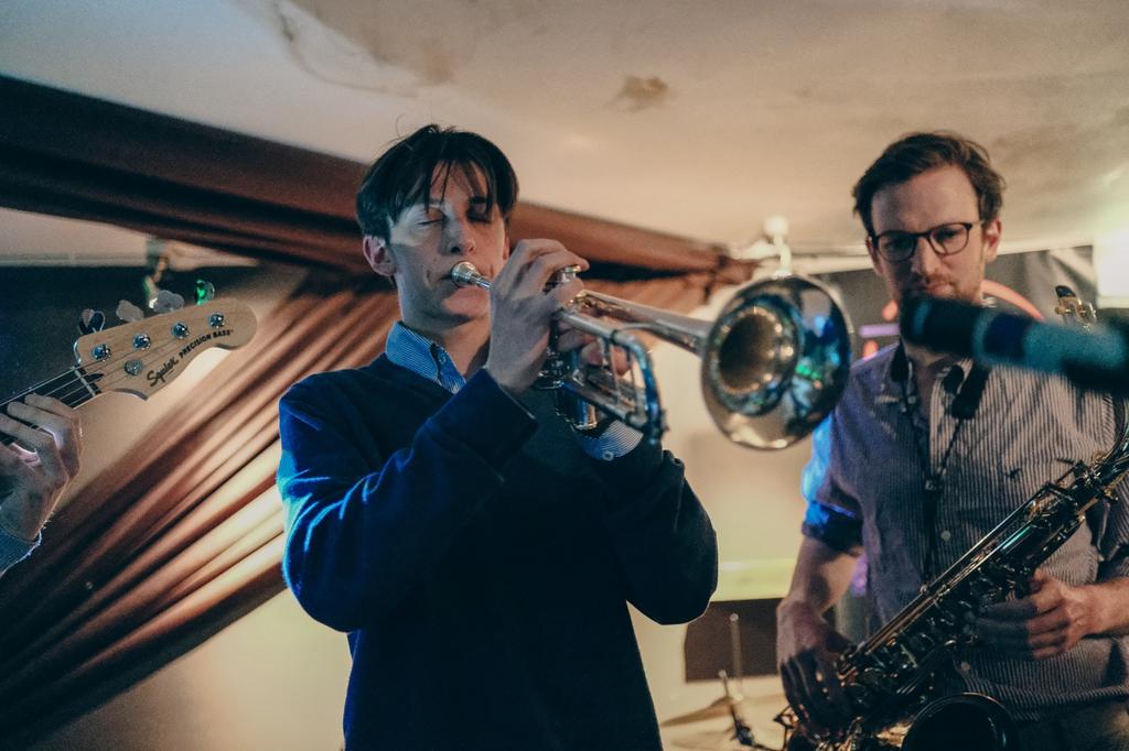 Trumpeter and saxophonist playing together at a Cambridge Jazz Society jam